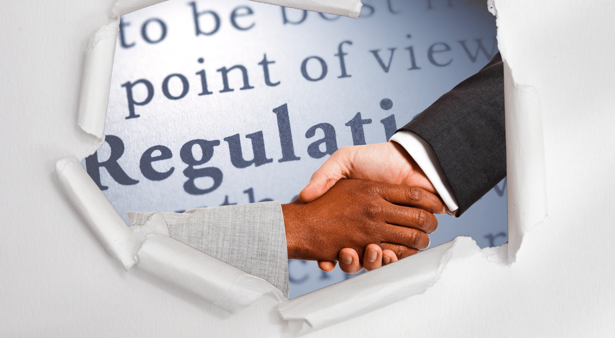 Two business professionals shaking hands through a torn paper opening revealing the word “Regulations,” symbolizing building relationships beyond federal contracting rules.