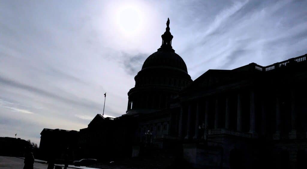 Morning sunlight over the U.S. Capitol dome in winter, symbolizing reflection and clarity during a Federal Sales Hot Wash.