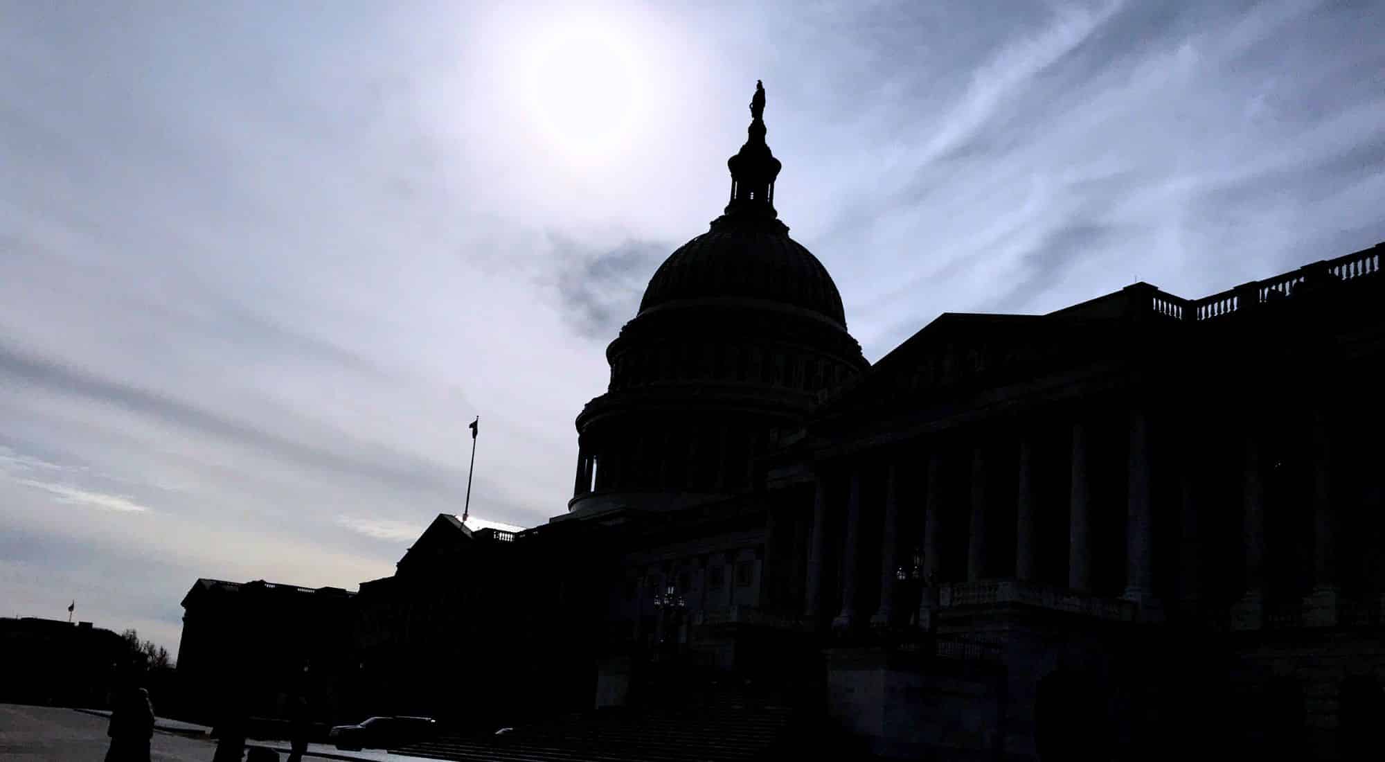 Morning sunlight over the U.S. Capitol dome in winter, symbolizing reflection and clarity during a Federal Sales Hot Wash.